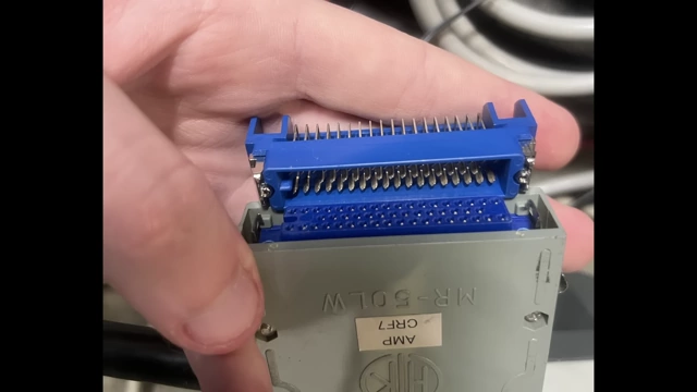 A close-up of an obsolete blue industrial connector