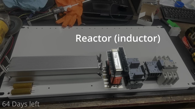 A line reactor (inductor) and brake resistors mounted on the controller's backplate