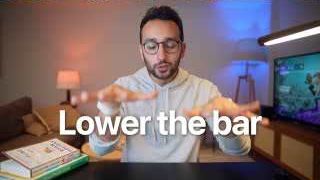 The advice "Lower the bar" is presented as a strategy for overcoming perfectionism and taking consistent action.