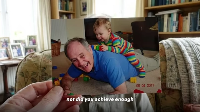 The speaker playing with his grandchild, emphasizing the importance of family time.