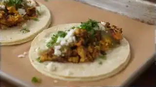 Chorizo egg tacos with salsa, queso fresco, and cilantro