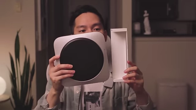 The Mac Mini being placed into a 3D printed sleeve prototype