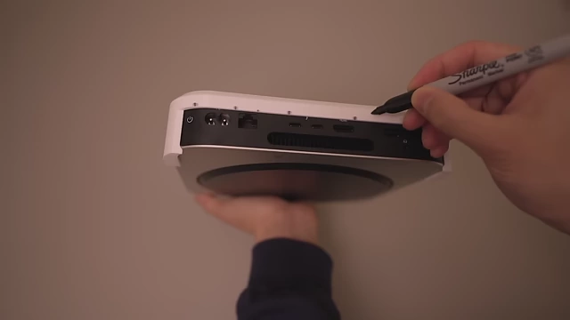 Markings being made on a white 3D-printed Mac Mini prototype