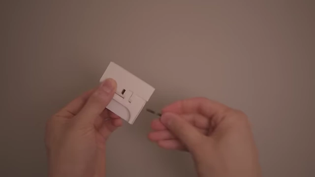 The creator inserting an Allen key into a 3D-printed hinge part