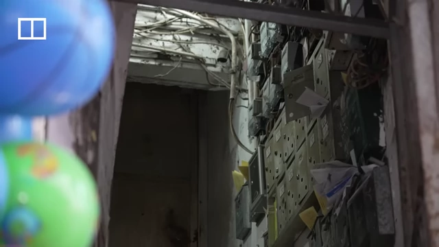 The entrance and mailboxes of the building where Auntie Ha lives in Sham Shui Po.