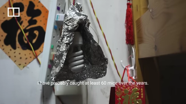 A lightbulb covered in aluminum foil, possibly to deter mice from the ceiling.