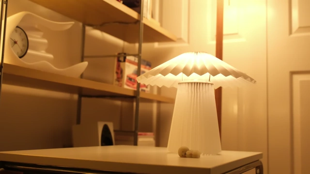 KUDDLAVA lamp radiating a soft glow