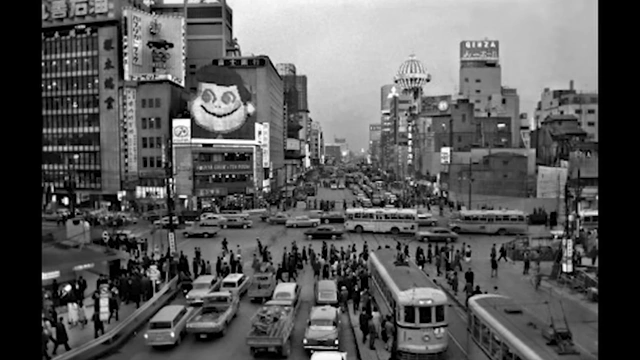 A bustling street scene in Japan during its economic boom, filled with cars and pedestrians