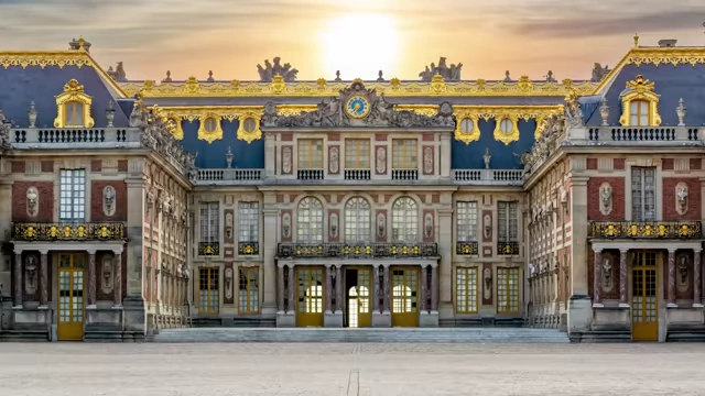 An exterior view of the opulent Palace of Versailles, built by King Louis XIV.