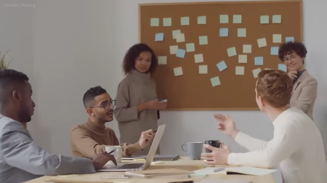 A group of colleagues collaborating on a team project in an office setting.