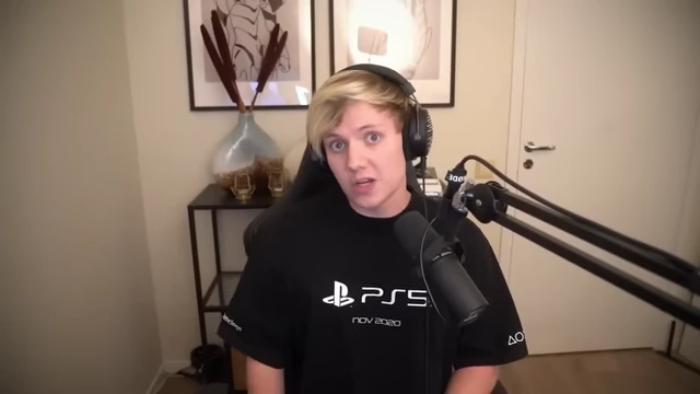 Pyrocynical wearing a PS5 shirt while speaking into a microphone, used to imply his significant personal spending habits.