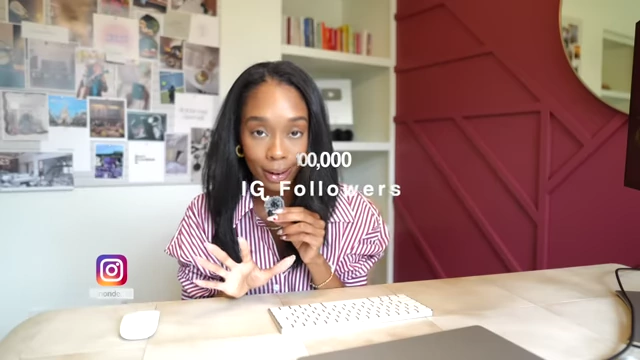 The speaker reveals her achievement of over 100,000 Instagram followers.
