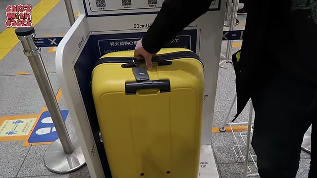 Checking a suitcase against the Shinkansen oversized baggage guidelines