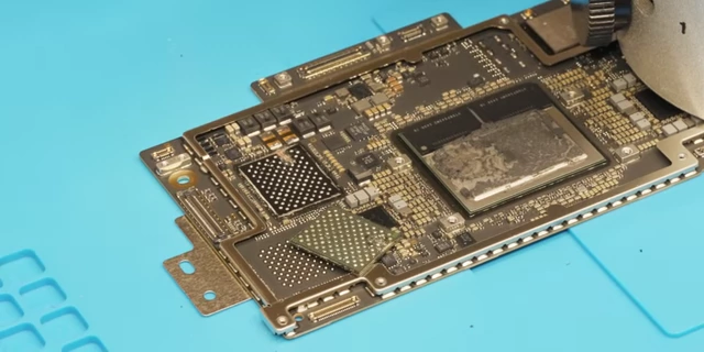 The original NAND chip being removed from the board