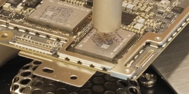 The new NAND chip "sucking down" onto the board during soldering