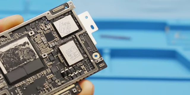 The MacBook Air logic board with both new NAND chips successfully installed