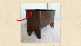 An old wooden chest with a severely warped lid that no longer closes properly, demonstrating the problem of unconstrained wood movement over centuries.