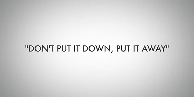 The mantra 'Don't Put It Down, Put It Away' promoting immediate tidying to prevent clutter.