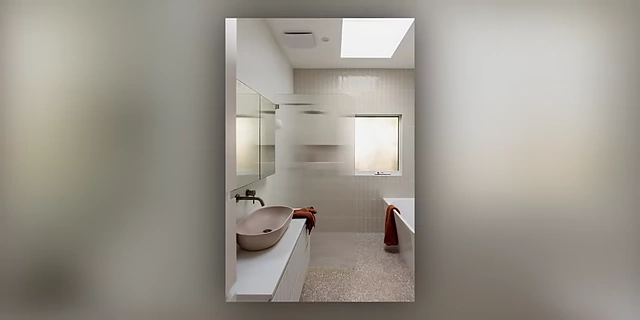 A clean and organized bathroom, serving as an example of a small, contained space to begin organizing.
