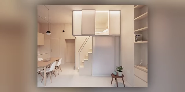A compact living space with a mezzanine bed and integrated storage, maximizing vertical space.