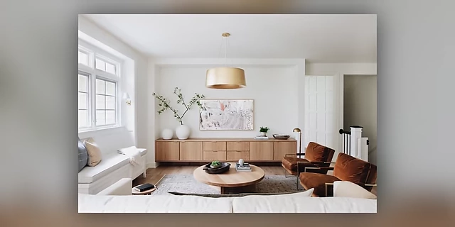 A living room featuring a long, low-profile built-in media console for ample storage.