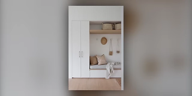 A well-designed entryway with a bench and overhead storage, providing an immediate drop zone.