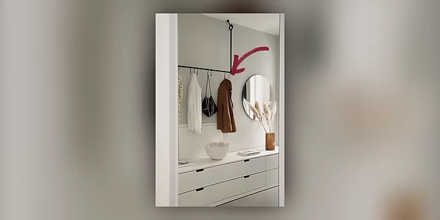 An overhead rail with hooks designed for easy hanging of clothes, indicated by an arrow.