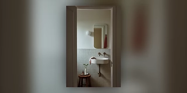 A well-organized small bathroom, demonstrating effective use of space in a confined area.