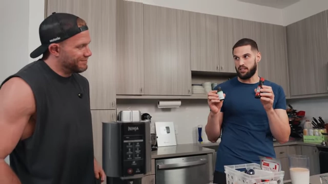 Nick holds two different mint extracts, emphasizing the importance of precise measurements.