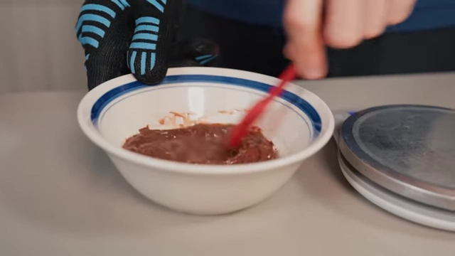 Melted chocolate mixed with oil in a bowl, prepared for mix-ins.