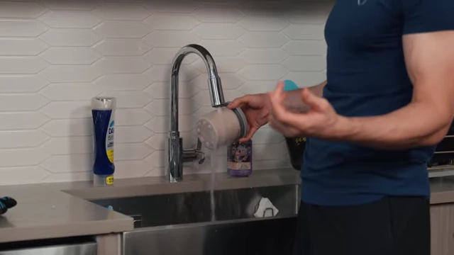 Nick rinses a frozen pint under hot water to soften the edges.