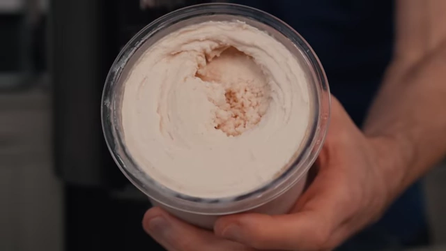 The ice cream consistency after the first spin, showing it's still partially powdery.