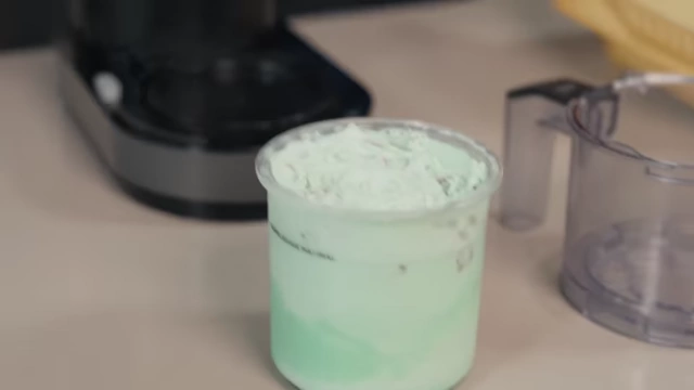 The smooth, creamy texture of the mint chocolate chip ice cream after processing.
