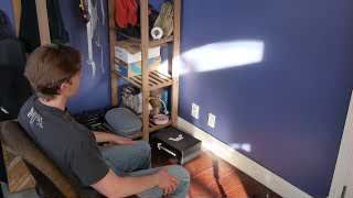 A person sitting and intently staring at a wall as part of a productivity experiment.