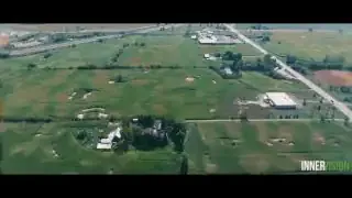 Aerial view of farmland with buildings and roads