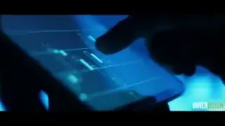 A person's hand interacting with a holographic graph on a tablet