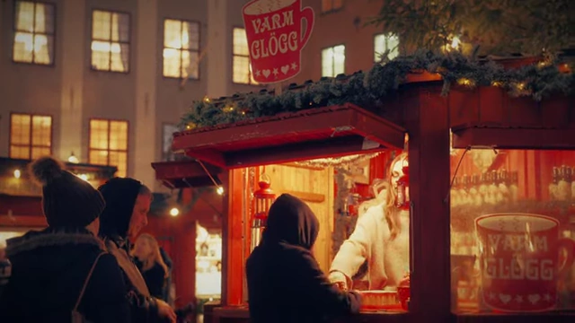 The final graded hero shot of a vendor in the holiday market