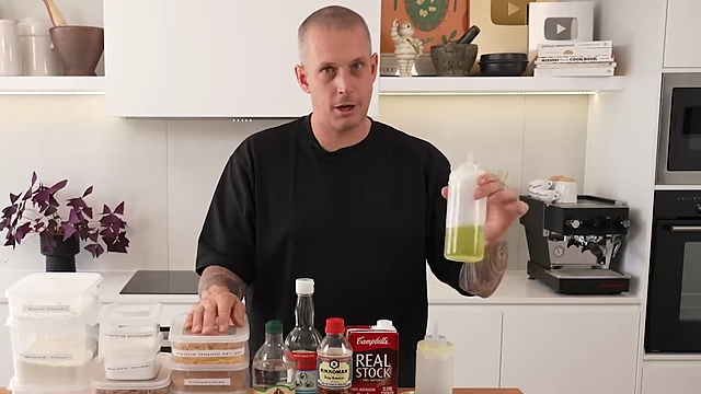 Squeeze bottles filled with high-temperature cooking oil (like grapeseed) and good quality olive oil for finishing, demonstrating practical storage for daily use.