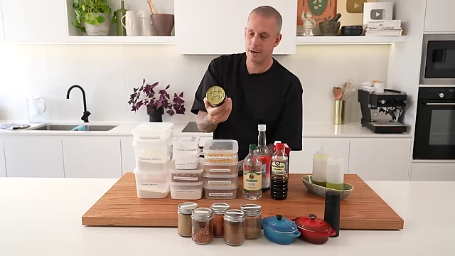 A can of Ardmona crushed vine-ripened tomatoes, with Andy advising to invest in higher-quality canned tomatoes for better sauces.