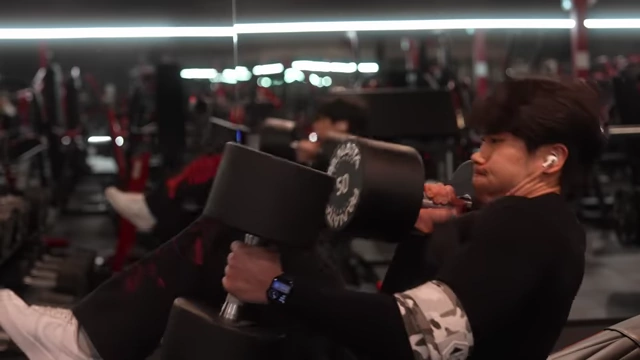 The speaker performing an incline dumbbell press