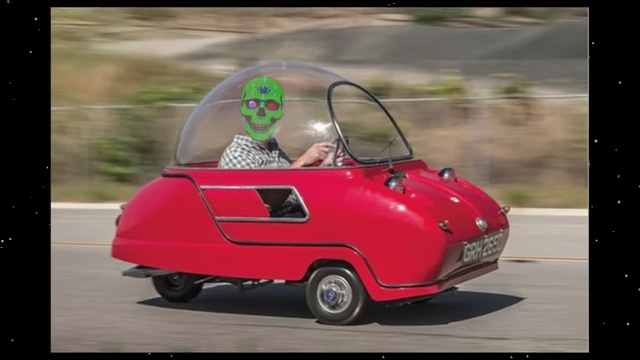 A person with a skull mask driving a tiny red car on the right side of the road, illustrating the convention of driving on a specific side.