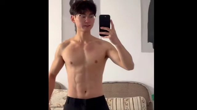 Xiao Ai proudly displaying his chiseled abs, a result of his dedicated fitness regimen