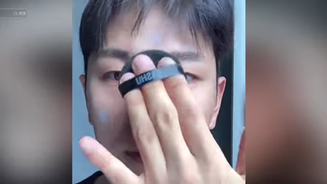 Xiao Ai applying powder to his face, demonstrating his adoption of a skincare and makeup regimen