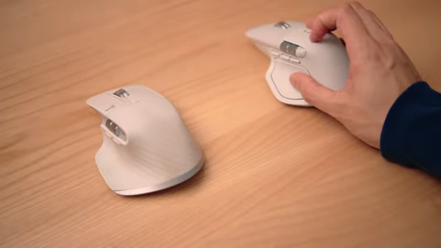 Two Logitech mice side-by-side, comparing the design and finish of the older and newer models.
