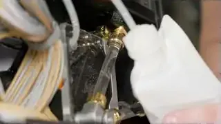 Coolant being poured into the custom water-cooled PC