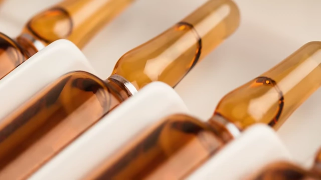 Vials of various vitamins and minerals, representing the intravenous treatment MN received in the hospital.