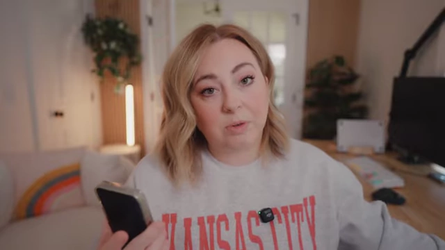 The speaker holds her iPhone, a common tool for everyday video capture.