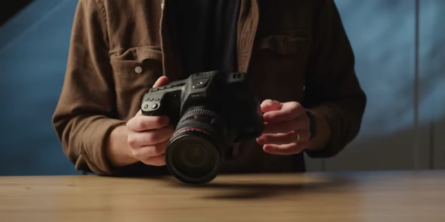 The Blackmagic Pocket 6K Pro camera being held by the user, showcasing its ergonomics.