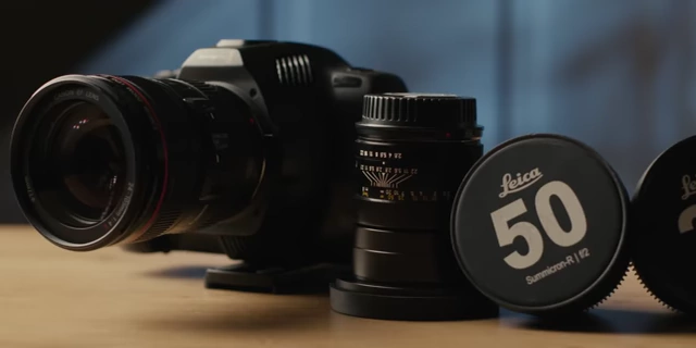 Various manual prime lenses sitting next to a Blackmagic Pocket 6K Pro camera.