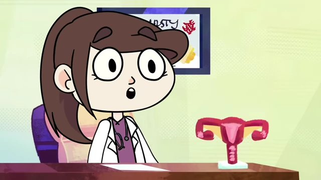 A cartoon doctor points to a uterus model on her desk while explaining the IUD insertion procedure to the patient.